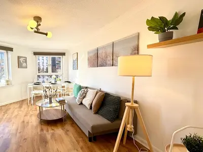 a living room with a couch and a table at Wonderfull stays new property near Glasgow 2 bedrooms in Dalmuir