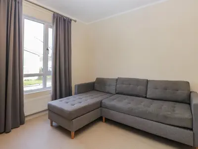 a living room with a couch and a window at Beechtree Timber Lodge 69B in Denny