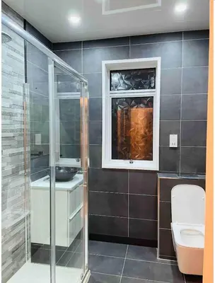a bathroom with a shower and a sink and a toilet at Large double room in a house at Glasgow Westend in Knightswood