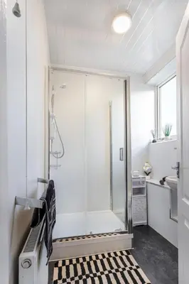 a glass shower in a bathroom with a sink at Cosy 3 bed home in Cardonald G52 in Cardonald