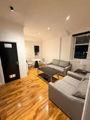 a living room with a couch and a table at The perfect place we call home in Dumbarton
