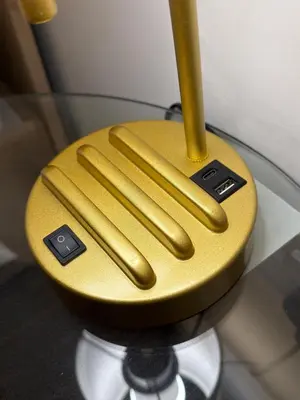 a yellow object with three remote controls on a table at The perfect place we call home in Dumbarton