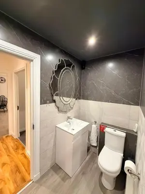 a bathroom with a toilet and a sink at The perfect place we call home 2 in Dumbarton