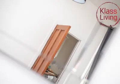 an open door in a room with a racket at Cosy Apartment by Klass Living Bellshill in Bellshill