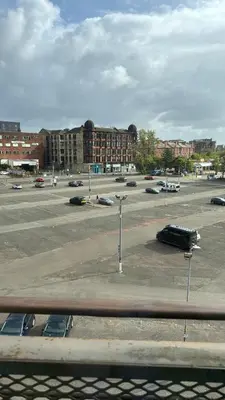a parking lot with cars parked in a parking lot at Skyline Serenity Cosy Home in Glasgow