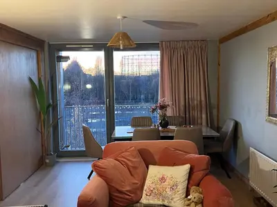 a living room with a couch and a table at Luxury New York Style Loft Apartment Homestay in Edinburgh