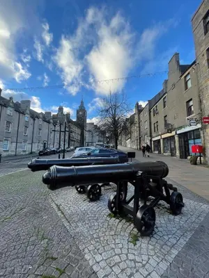 a cannon sitting on the side of a street at Hidden Gem in Stirling