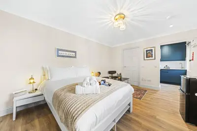 a bedroom with a bed with a towel on it at O Hill Crescent 1 Bedroom Studio - Edinburgh in Edinburgh