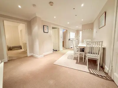 a dining room with a table and chairs at Blantyre Cosy Hideaway in Edinburgh