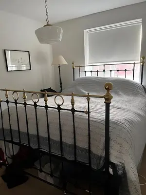a bedroom with a bed and a window and a lamp at Deal - The place to stay in Moffat