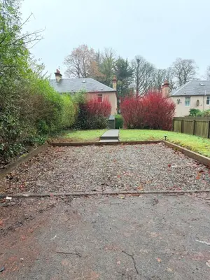 a driveway with leaves on the ground in a yard at Bright and spacious 2 bedroom flat in Auchterarder