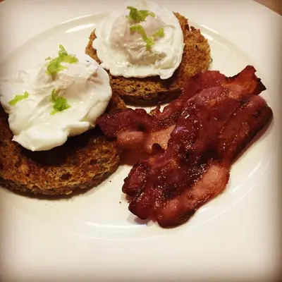 a plate of food with bacon and sour cream at Melfort House in Kilmelford