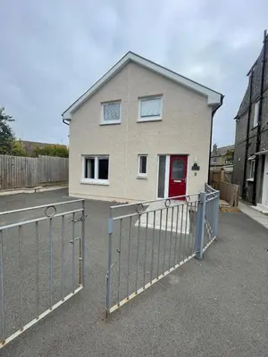 a house with a gate in front of it at ShekNup Home in Edinburgh