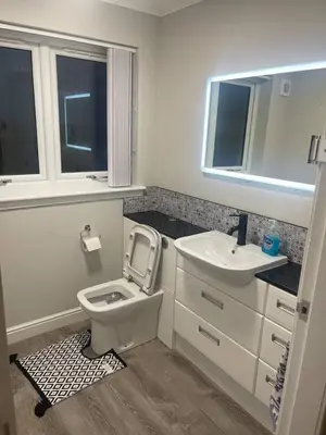 a bathroom with a toilet and a sink at ShekNup Home in Edinburgh