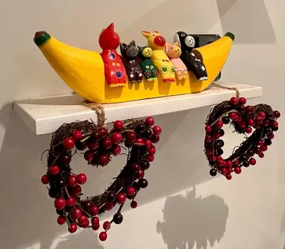 a shelf with a banana and a heart and beads at Spacious, bright home in Central Scotland sleeps 6 in Balfron