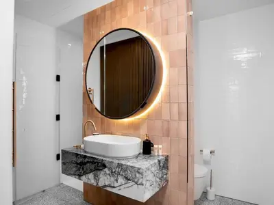 a bathroom with a sink and a mirror on a wall at 2 bed Luxury apartment with balcony in Moffat
