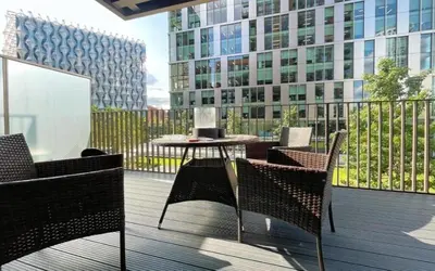 a balcony with a table and chairs on a building at 2 bed Luxury apartment with balcony in Moffat