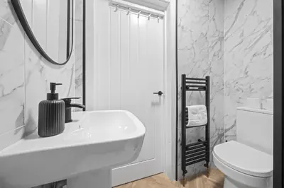 a white bathroom with a sink and a toilet at City-Close 1-Bedroom Apartment - Edinburgh in Edinburgh
