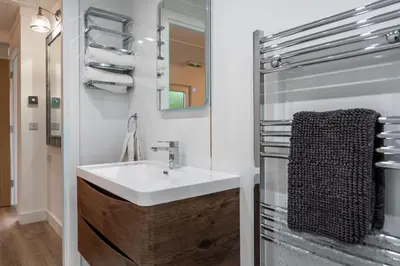 a bathroom with a sink and a mirror at Moffat Apartment with Hot Tub in Moffat