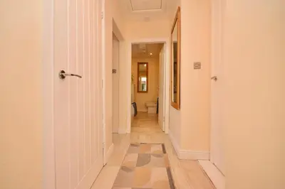an empty hallway with a toilet in a room at Peaceful Village Flat 2 Bedrooms in Douglas