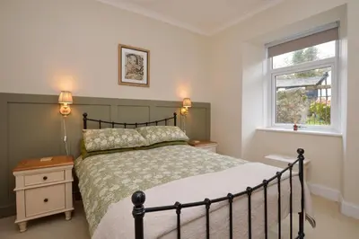 a bedroom with a bed and a window at Seascape in Kames