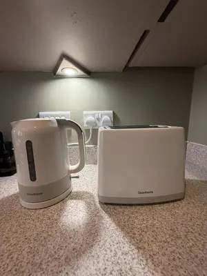 two appliances sitting on a counter next to each other at Pearl House in Moffat