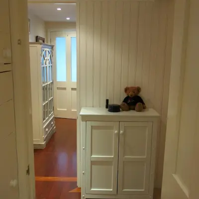 a teddy bear sitting on a counter in a room at THE WHEEL,Harbour view apartment for two - private front entrance and patio in Moffat