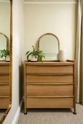 a dresser with a mirror and two plants on it at 3-Bed Georgian Townhouse Next to Wellbeing Clinic in Stirling