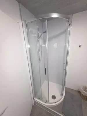 a shower with a glass door in a bathroom at The Jet Nest in Moffat
