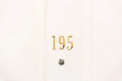 a white door with the number on it at 2 bed flat near Livingston North Station in Livingston