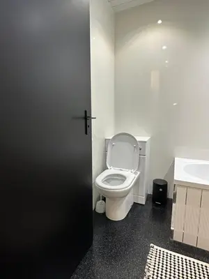 a bathroom with a white toilet and a sink at Hydro Secc House Glasgow 10 minute walk in Glasgow