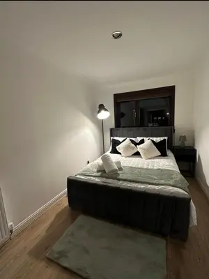 a bedroom with a large bed with a large mirror at Hydro Secc House Glasgow 10 minute walk in Glasgow
