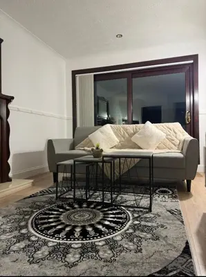 a living room with a bed and a table at Hydro Secc House Glasgow 10 minute walk in Glasgow