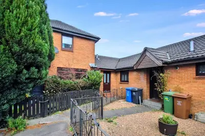 a brick house with a fence in front of it at Hydro Secc House Glasgow 10 minute walk in Glasgow