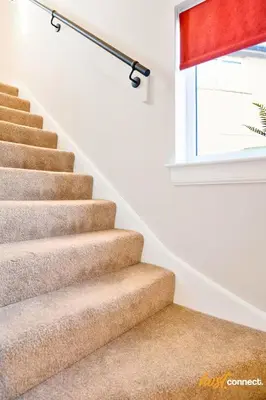 a staircase in a home with a red window at 3Bed House I Sleeps 6 I Dunfermline in Dunfermline