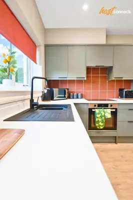 a kitchen with a sink and a counter top at 3Bed House I Sleeps 6 I Dunfermline in Dunfermline
