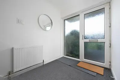 an empty room with a large window and a rug at 2BR Sleeps 6 with Parking Near Linlithgow Palace in Linlithgow