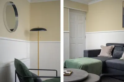 a living room with a blue couch and a mirror at 2BR Sleeps 6 with Parking Near Linlithgow Palace in Linlithgow