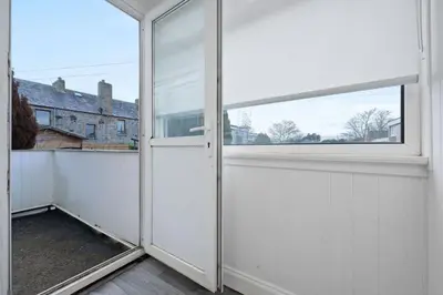 an open door to a balcony with a window at 2BR Sleeps 6 with Parking Near Linlithgow Palace in Linlithgow