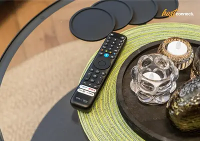 a remote control sitting on top of a table at 2 Bed Home in Paisley I Sleeps 4 in Paisley