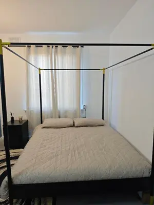 a bedroom with a bed with a canopy at The Boswall Residence in Edinburgh