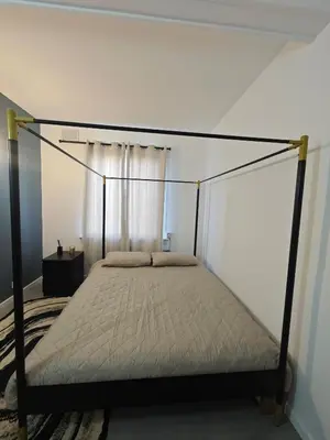 a bed with a canopy in a bedroom at The Boswall Residence in Edinburgh