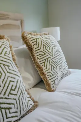 a white bed with two pillows on top of it at Dunward House in Livingston