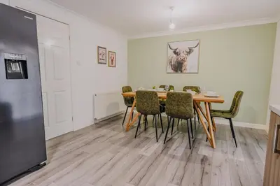 a dining room with a table and chairs at Dunward House in Livingston