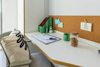 a desk in an office with a laptop on it at For Students Only - Dunaskin Mill in Glasgow in Glasgow