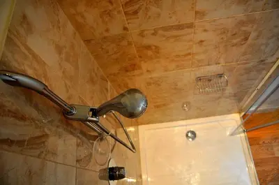 a shower with a shower head in a bathroom at Finchairn Farmhouse in Lochgilphead
