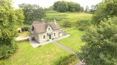 an aerial view of an old house in a field at The School House in Lochgilphead