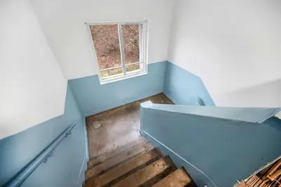 an empty room with a staircase with a window at 2BR Oban Retreat with Free Parking in Oban