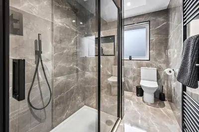 a bathroom with a shower and a toilet at 2BR Oban Retreat with Free Parking in Oban