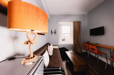 a room with a lamp on top of a table at Calm, Cosy & Central Apartment near Meadows 10 in Edinburgh